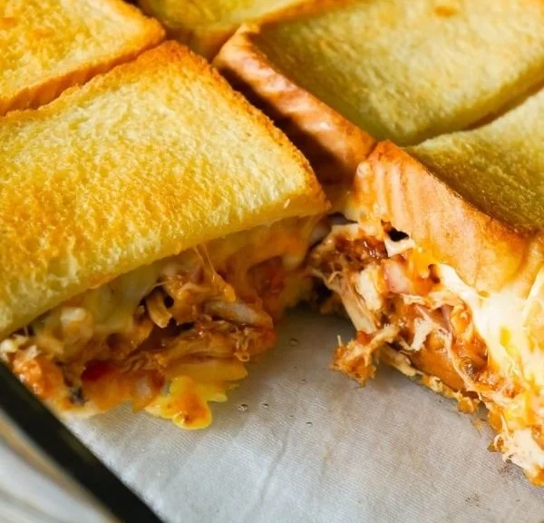 BBQ chicken casserole with grilled cheese topping served on a plate