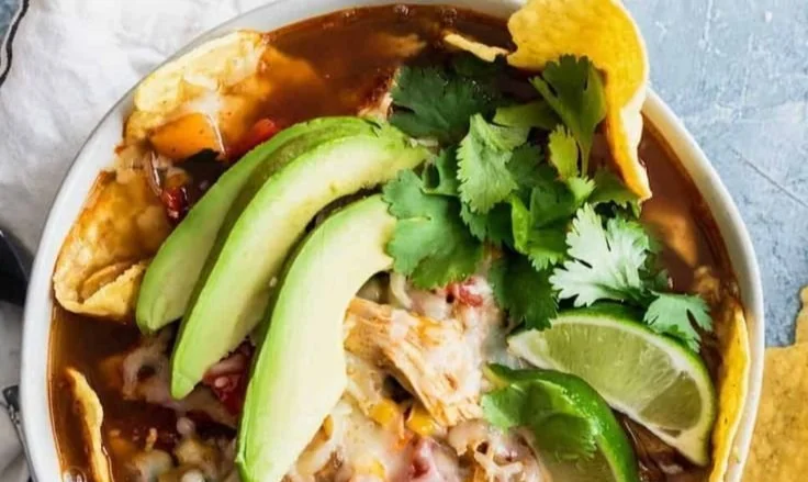 A delicious bowl of Chicken Tortilla Soup garnished with tortilla strips and cilantro