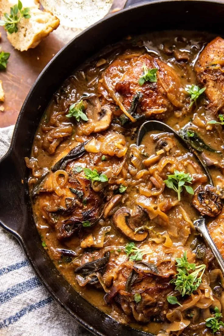 Cider Braised Chicken served with Caramelized Onions on a plate