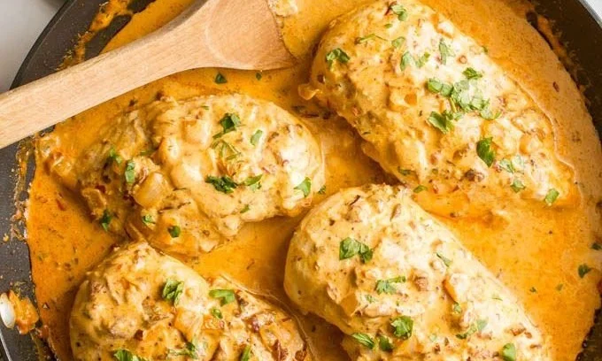 Creamy Chipotle Chicken served on a plate with fresh herbs