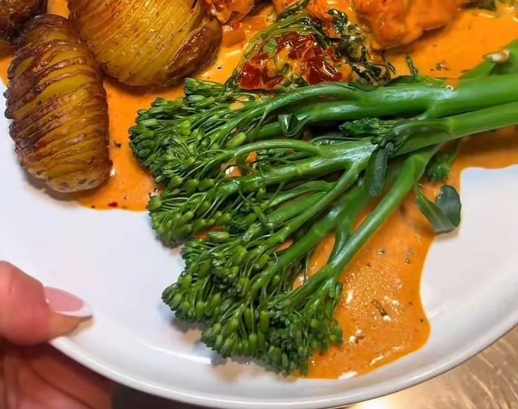 Creamy Marry Me Chicken with Roasted Hasselback Potatoes on a plate