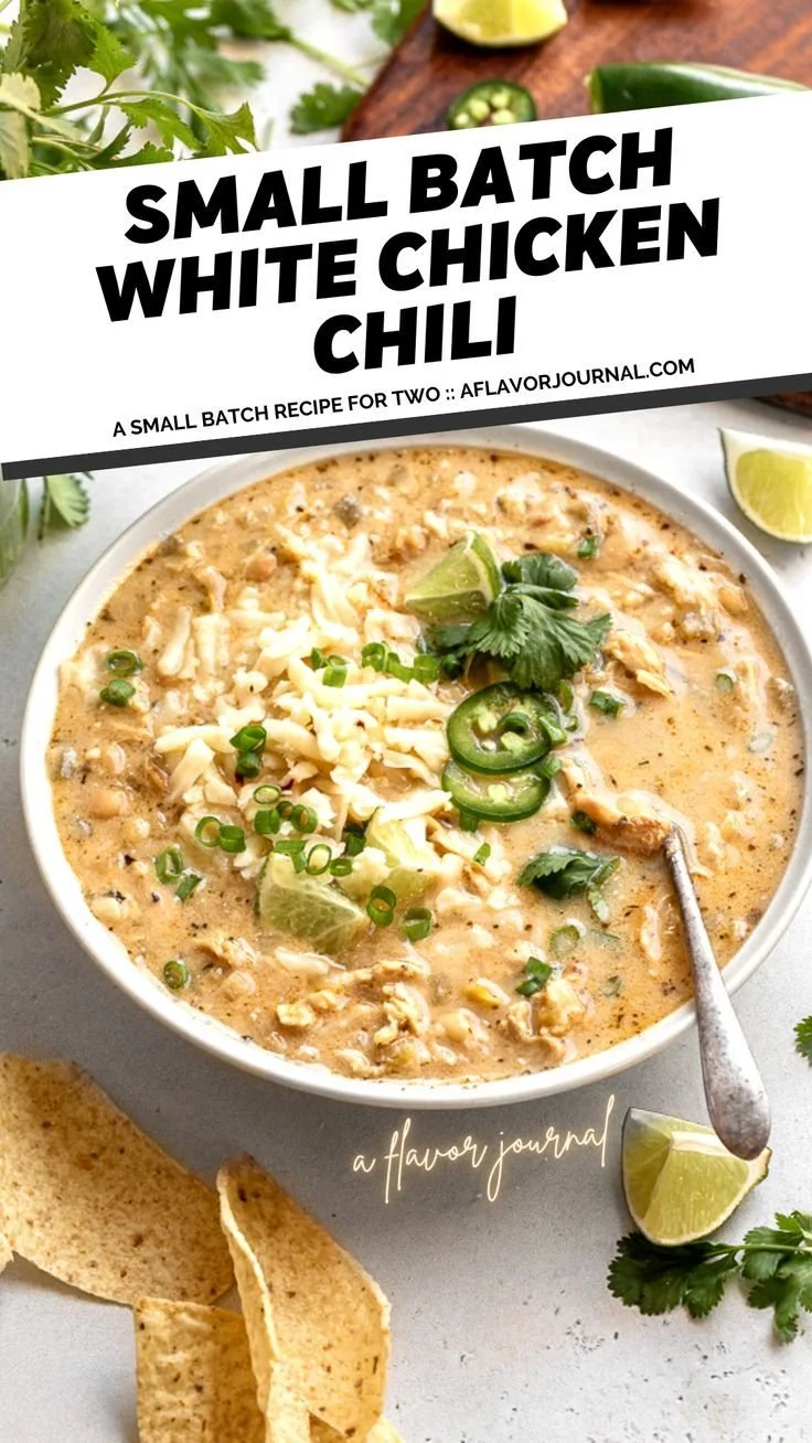 Creamy white chicken chili in a bowl garnished with cilantro and lime