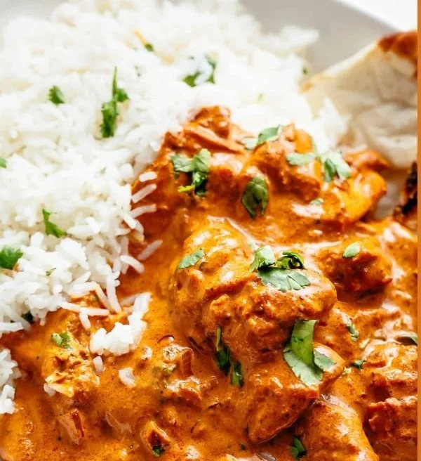 Delicious one pan chicken tikka masala served with rice and garnished with cilantro