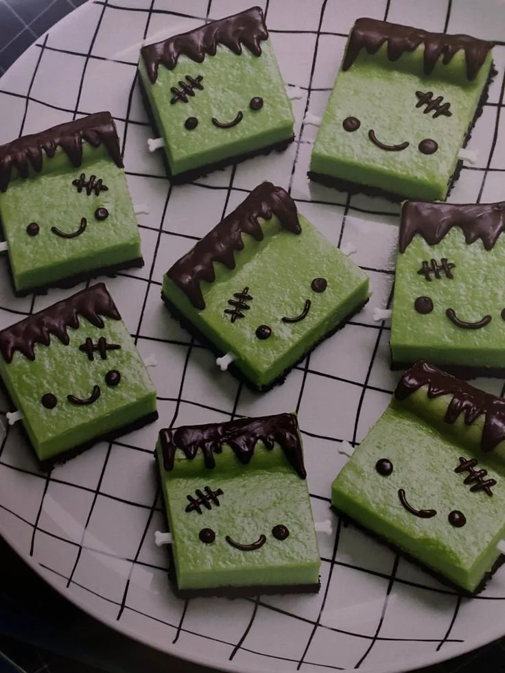 Frankenstein cheesecake bars with Halloween-themed decorations