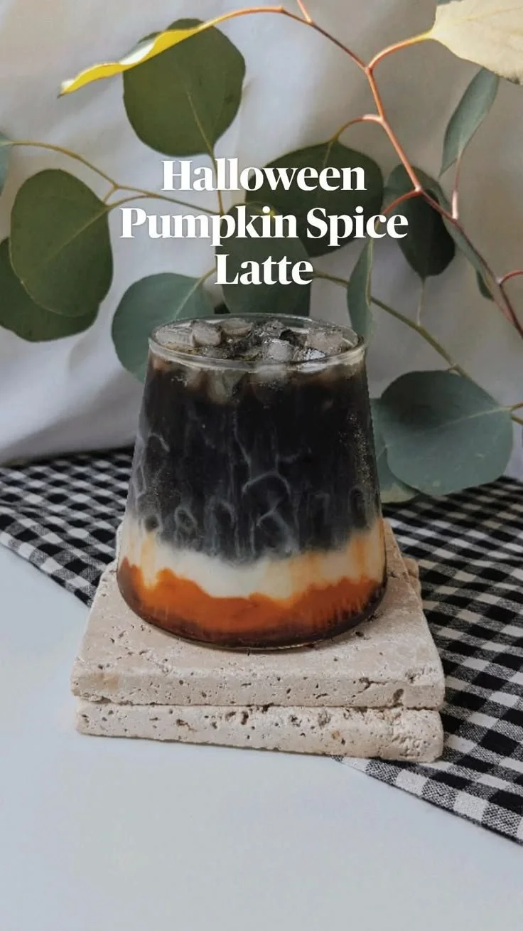 Delicious Halloween Pumpkin Spice Latte topped with whipped cream and cinnamon
