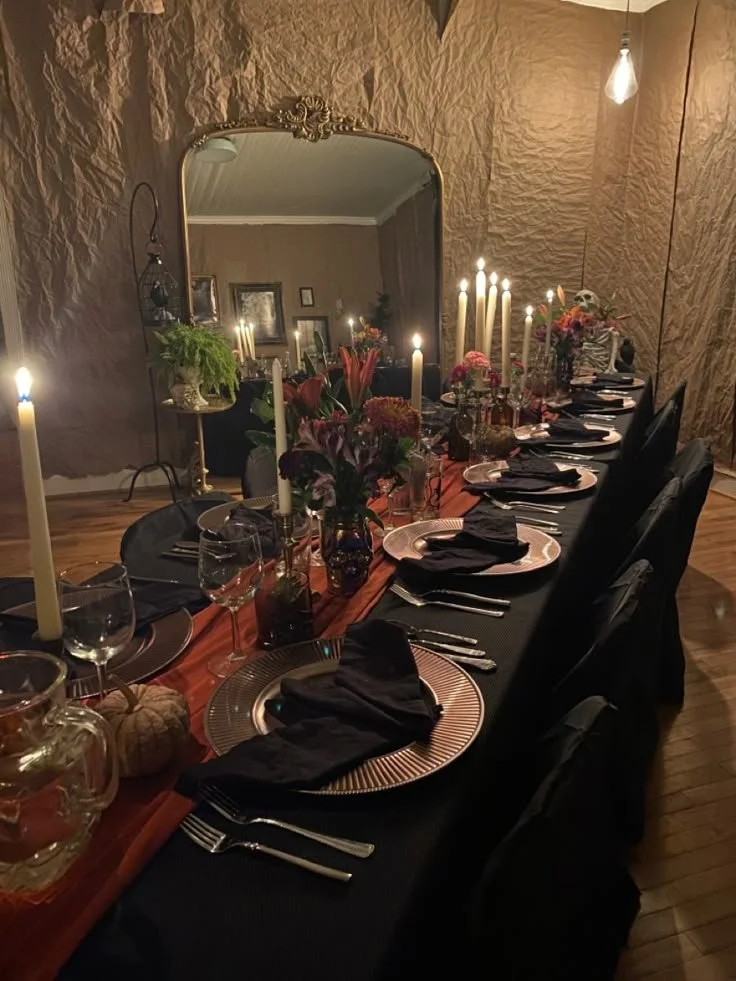 Spooky table setting for a haunted dinner party with eerie decorations.