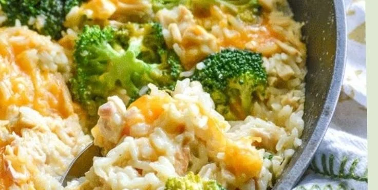 One-pot cheesy chicken with broccoli and rice served in a bowl