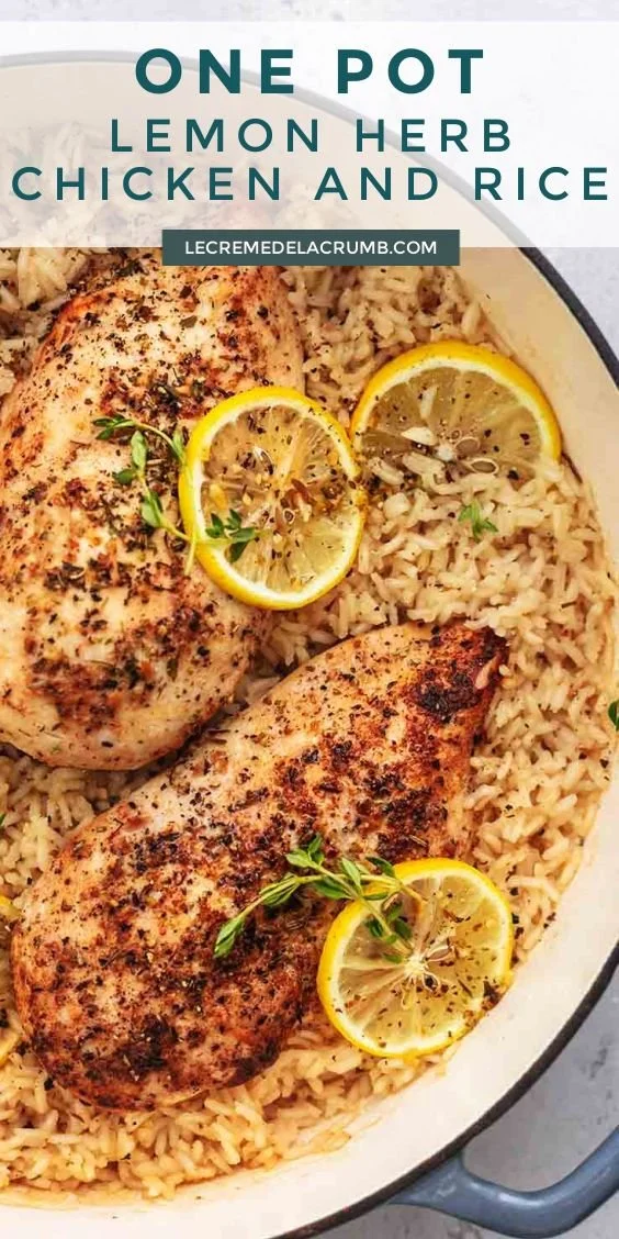 One Pot Lemon Herb Chicken and Rice dish garnished with herbs and lemon slices