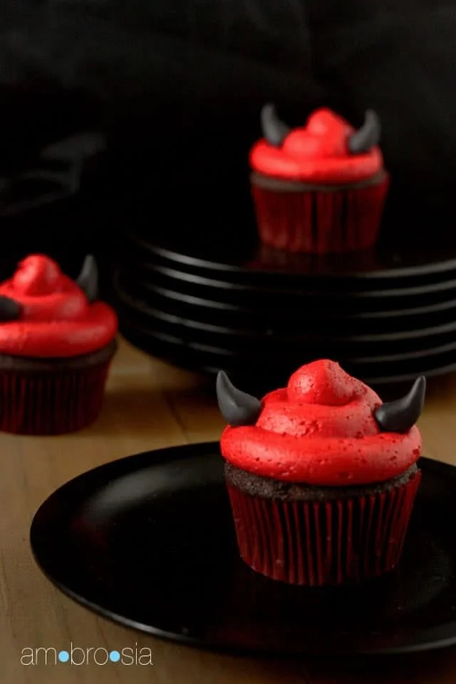 A selection of festive Halloween cupcakes with spooky decorations.