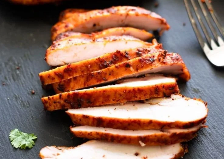 Deliciously smoked chicken breasts ready to serve with herbs and spices.