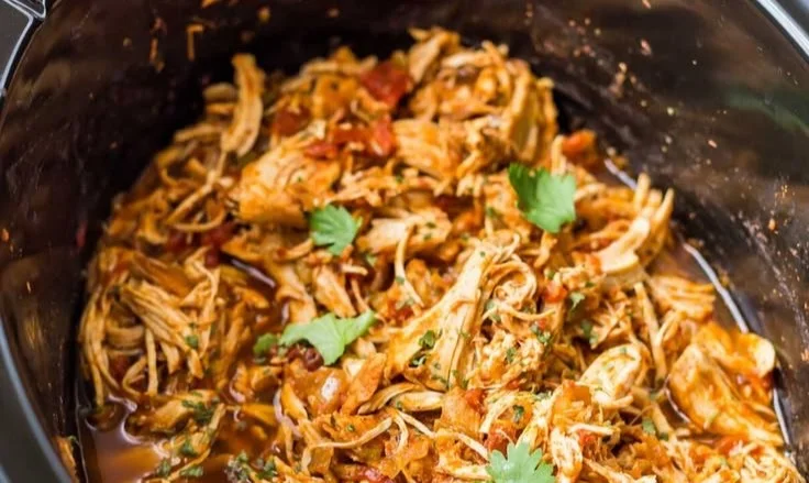Slow Cooker Mexican Shredded Chicken served with fresh toppings
