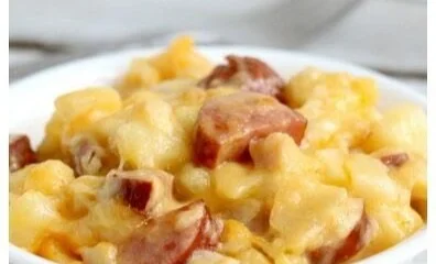Delicious slow cooker sausage and potato casserole served in a bowl
