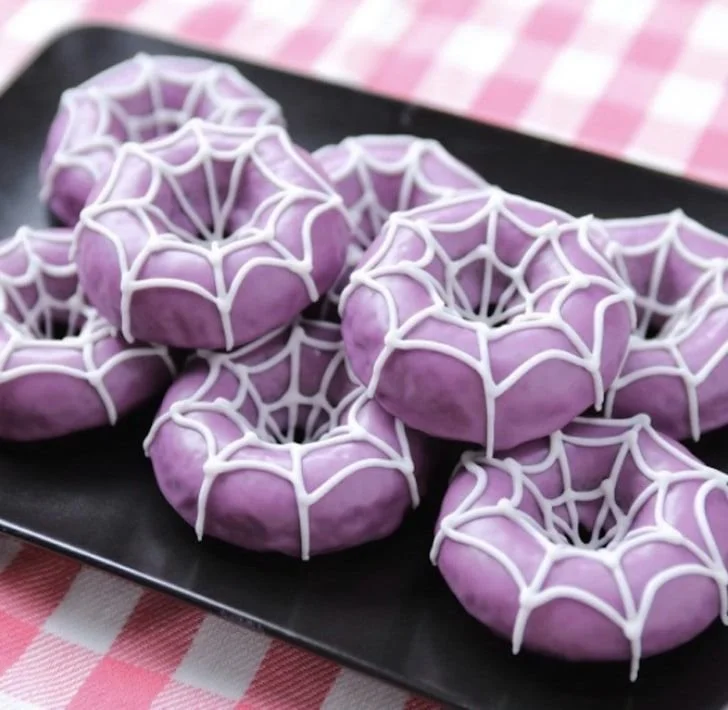 Colorful Halloween doughnuts decorated with spooky designs for festive celebrations